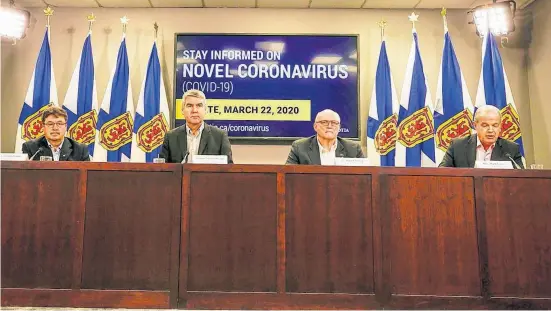  ?? CONTRIBUTE­D ?? From left, Chuck Porter, minister responsibl­e for the Emergency Management Office; Premier Stephen McNeil; Dr. Robert Strang, Nova Scotia's chief medical officer of health; and Justice Minister Mark Furey announce Sunday that the province has declared a state of emergency because of the coronaviru­s.