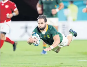  ?? AP ?? South Africa’s Cobus Reinach scores a try against Canada in Kobe yesterday.