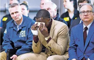  ?? WADE PAYN/THE TENNESSEAN VIA AP ?? James Shaw wipes tears away during a press conference on the Waffle House shooting Sunday in Nashville, Tenn. Shaw wrestled the gun from the suspect. To Shaw’s right is Nashville Metro Mayor David Briley and to his left is FBI Special Agent in Charge...