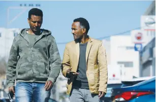  ?? (Amir Cohen/Reuters) ?? ERITREANS IN Tel Aviv. Deporting thousands of Africans migrants is not a breach of national or internatio­nal law, says the Immigratio­n Policy Center spokesman.