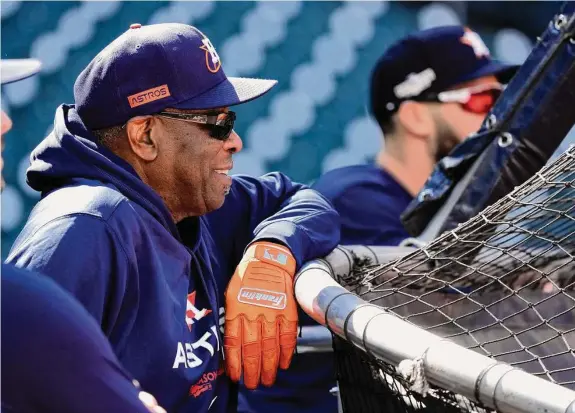  ?? Photos by Karen Warren/Staff photograph­er ?? There was no tension for the Astros and manager Dusty Baker, watching Tuesday’s batting practice, as another turn on baseball’s postseason stage approached.