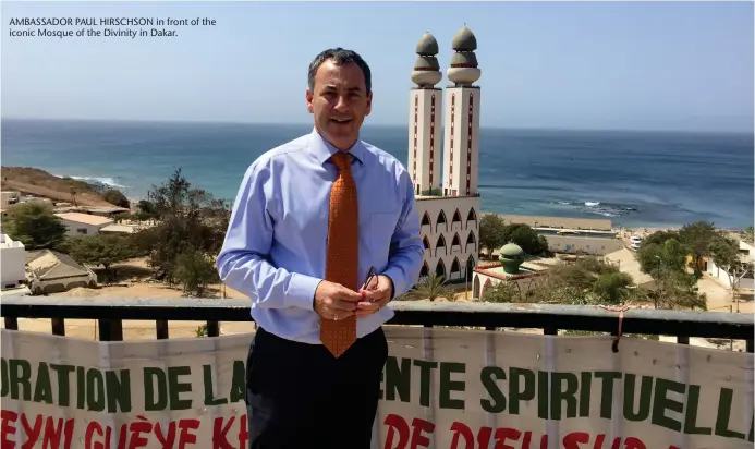  ??  ?? AMBASSADOR PAUL HIRSCHSON in front of the iconic Mosque of the Divinity in Dakar.