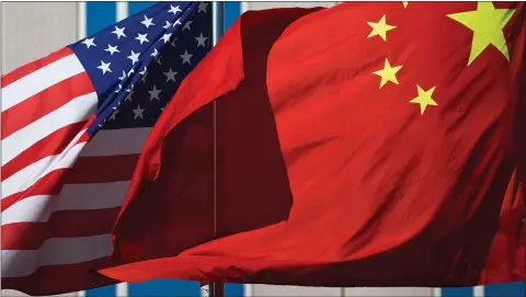  ?? Picture: Andy Wong ?? A de-escalation of America’s trade war with China would be good news for investors