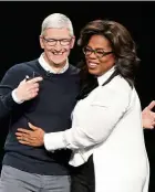  ?? — AP ?? Apple CEO Cook and Winfrey at the Steve Jobs Theater at the Apple event.