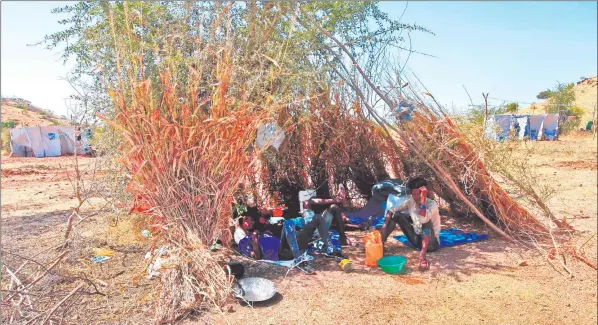  ?? Photo: Nampa/AFP ?? Uncertaint­y… Ethiopian refugees who fled fighting in Tigray province lay in the shade in a straw shack at the Um Rakuba camp in Sudan’s eastern Gedaref province.