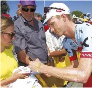  ??  ?? Boswell signs autographs for fans at the Tour, but keeps fame in perspectiv­e