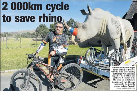  ?? Picture: RANDELL ROSKRUGE ?? RHINO RIDE: Cyclist Wayne Bolton and his co-traveller ‘Olli’ the rhino arrived safely at Mpongo Park yesterday as part of the 2 000km One Land Love It Frontier Ride. The cycle bid to help save the rhino will visit 20 game reserves by the time the...