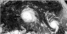  ?? NOAA 2017 ?? A satellite image shows the eye of Hurricanes Irma, left, and Jose in the Atlantic Ocean. Six major hurricanes spun around the Atlantic in 2017, including Harvey, Irma and Maria.