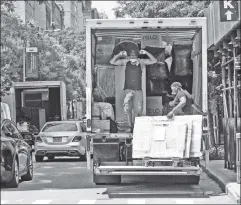  ?? ?? Exodus: One of countless moving trucks in the city in July 2020.