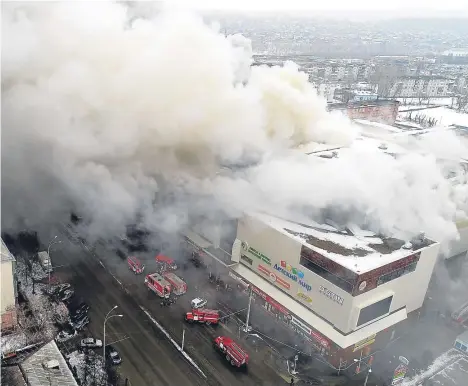  ??  ?? A SHOPPING centre fire in a Siberian city has killed 37 people and 27 are considered missing, the Russian government said.
The fire at the four-story Winter Cherry mall in Kemerovo was extinguish­ed early today after burning for hours.
Many of the...