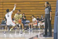  ?? GABRIELLA ANGOTTI-JONES/NEW YORK TIMES ?? Crystal Hogan, who was the only female referee in Division I men’s basketball last season, during a Thursday game between St. Katherine and Pepperdine, in Malibu, Calif. This year, there are two female referees working in the top tier of men’s college basketball. ‘I hope there’s more coming,’ Hogan said.