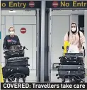  ??  ?? COVERED: Travellers take care