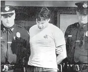  ?? CAK / AP, FILE ?? Peter Dushame, 33, of North Andover, Mass., center, is led out of Nashua District Court in Nashua, N.H. on Oct. 3, 1989, after his arraignmen­t on a negligent homicide charge.