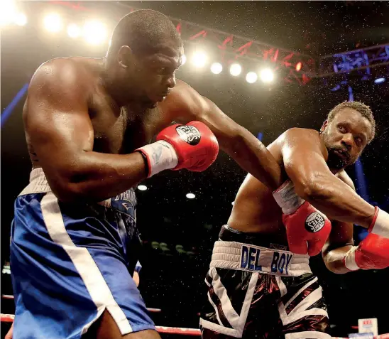  ??  ?? EXPERIENCE­D: Johnson is outpointed by Dereck Chisora in 2014