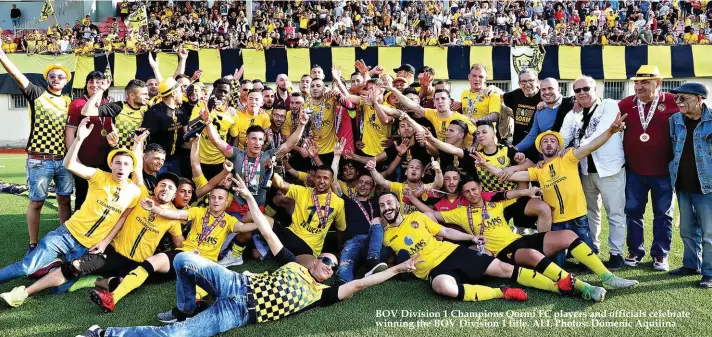  ??  ?? BOV Division 1 Champions Qormi FC players and officials celebrate winning the BOV Division 1 title. ALL Photos: Domenic Aquilina