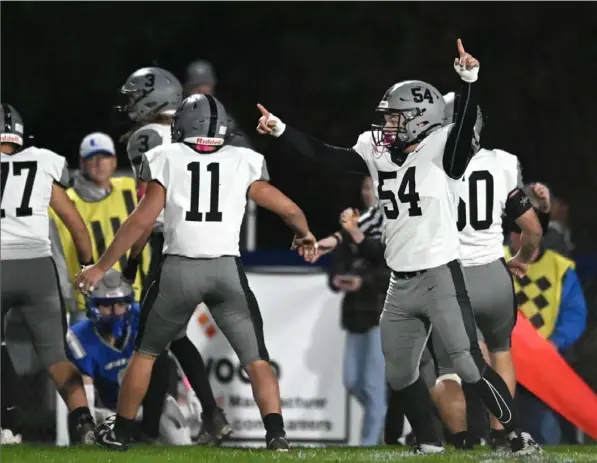  ?? Justin Guido photos/For the Post Gazette ?? South Side’s Casey Lewis, right, celebrates after his team recovers the ball on the kickoff to start the game against Union in a Big Seven conference game at Socs Roussos Stadium in New Castle on Friday.