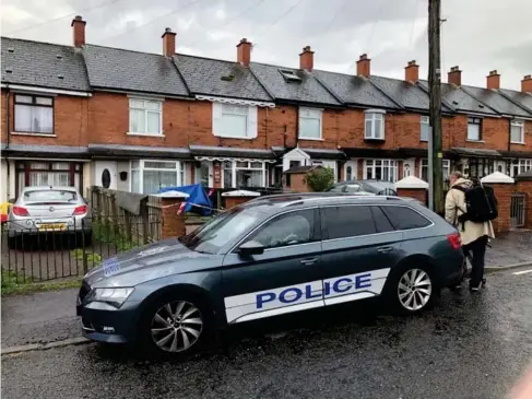  ?? (PA) ?? Police at the scene in Ardoyne,w here a baby died and another young child was critically injured