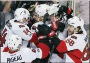  ?? MICHAEL DWYER — THE ASSOCIATED PRESS ?? The Ottawa Senators including, Clarke MacArthur (16), Alex Burrows (14), Mike Hoffman (68) and Jean-Gabriel Pageau (44) celebrate after defeating the Boston Bruins 3-2 during overtime in game six of a first-round NHL hockey Stanley Cup playoff series,...