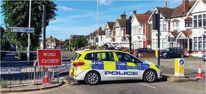  ?? ?? Crime scene: Police block off the road where the attack happened as officers investigat­e yesterday