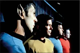  ?? Democrat-Gazette file photo ?? Science officer Spock (Leonard Nimoy), Capt. Kirk (William Shatner), medical officer “Bones” McCoy (DeForest Kelly) and chief engineer Scott (James Doohan) look to a better tomorrow.