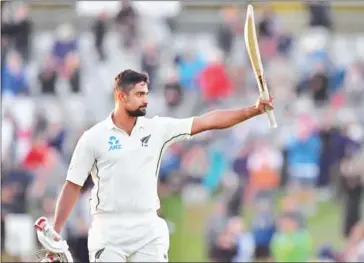  ?? MARTY MELVILLE/AFP ?? New Zealand’s Ish Sodhi celebrates as he walks from the field on Tuesday after New Zealand won the Test series against England, at Hagley Oval in Christchur­ch.