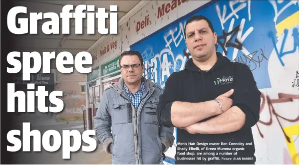  ?? Picture: ALAN BARBER ?? Men’s Hair Design owner Ben Connoley and Shady Elbelli, of Green Mumma organic food shop, are among a number of businesses hit by graffiti.