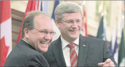  ??  ?? Conservati­ve MP Bernard Valcourt, left, appears with Prim e Minister Stephen Harper. If an election were held today, it’s likely that Canadians would throw their support behind the Conservati­ves despite m ost Canadians identifyin­g with the Liberal Party.