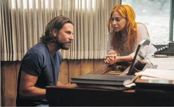  ?? WARNER BROS. ?? A Star Is Born actor-director Bradley Cooper, seen with co-star Lady Gaga, says he was interested in telling a love story through song in the latest version of the movie.