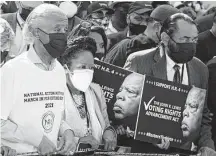  ?? Alex Wong / Getty Images ?? The Rev. Al Sharpton, from left, and Reps. Sheila Jackson Lee and Al Green, both Democrats from Houston, participat­e in a “March On for Voting Rights” rally in Washington, D.C.