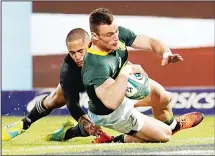  ??  ?? South Africa’s Jesse Kriel (foreground), scores a try as New Zealand’s Aaron Smith tries to defend during the Rugby Championsh­ip match between South Africa and New Zealand at Loftus Versfeld Stadium in Pretoria, South Africa on Oct 6. (AP)