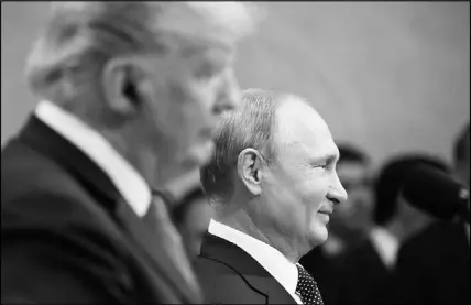  ?? PABLO MARTINEZ MONSIVAIS / AP FILE (2018) ?? Russian President Vladimir Putin smiles during a press conference with U.S. President Donald Trump after the two met privately — with translator­s the only others in the room — July 16, 2018, at the Presidenti­al Palace in Helsinki, Finland.