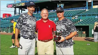  ?? SUBMITTED PHOTO ?? Scott Hahn Jr., right, is joined by Phillies public address announcer Dan Baker, center, and Rick Woodcock, Hahn’s Babe Ruth manager, for a charity appearance at Campbell’s Field in Camden in 2015.