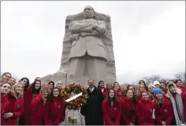  ?? JOSE LUIS MAGANA – THE ASSOCIATED PRESS ?? Martin Luther King III, center, poses with students at the Martin Luther King, Jr. Wreath Laying Ceremony at the Martin Luther King Jr. Memorial in Washington on Monday.