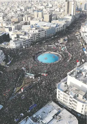  ?? OFFICIAL KHAMENEI WEBSITE/HANDOUT VIA REUTERS ?? Thousands of mourners attend the funeral procession in Tehran for Iranian Maj.-Gen. Qassem Soleimani and Iraqi militia commander Abu Mahdi al-Muhandis on Monday.