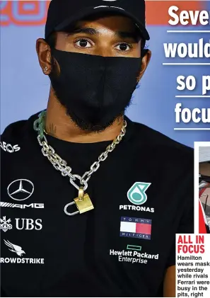  ??  ?? ALL IN FOCUS
Hamilton wears mask yesterday while rivals Ferrari were busy in the pits, right