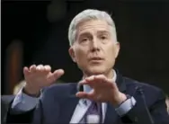  ?? THE ASSOCIATED PRESS ?? Supreme Court Justice nominee Neil Gorsuch gestures as he testifies on Capitol Hill in Washington at his confirmati­on hearing Tuesday before the Senate Judiciary Committee.