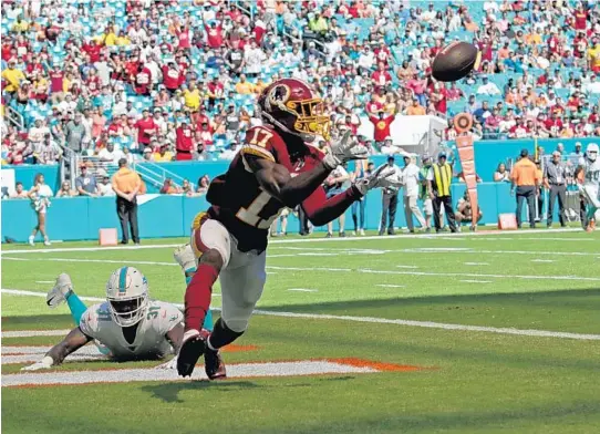  ?? PHOTOS BY JOHN MCCALL/SUN SENTINEL ?? Redskins wide receiver Terry McLaurin catches a pass for a touchdown against the Dolphins during the first half of Sunday’s game.