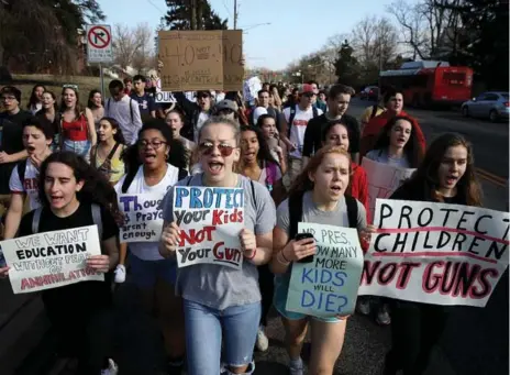  ?? WIN MCNAMEE/GETTY IMAGES ?? Students from Montgomery Blair High School in Maryland march in support of gun reform legislatio­n on Feb. 21, in the wake of the Florida mass shooting.