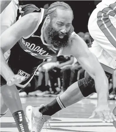  ?? ?? Nets guard James Harden found the going less comfortabl­e, or rewarding, Wednesday night against the Heat.