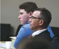  ?? PHOTO BY MICHAEL PATRICK/NEWS SENTINEL ?? William Riley Gaul and his defense attorney Wesley Stone are seen on Friday. Gaul, a former Maryville College football player, is charged in the 2016 shooting death of his 16-year-old ex-girlfriend Emma Jane Walker.