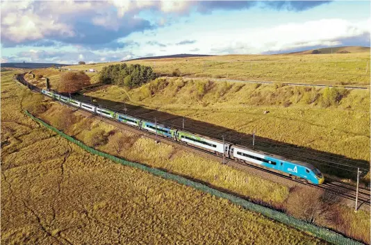  ?? AVANTI WEST COAST ?? Above: Pendolino ‘Climate train’ No. 390121 will have its nameplates applied in the coming weeks. It is pictured on October 30, 2021 near Shap in Cumbria while taking delegates from Euston to Glasgow Central for COP26.