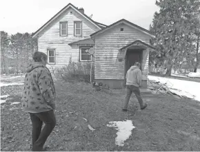  ??  ?? Betty Jo Johnson and Bruce Drinkman arrive to start repairing the circa-1930 house on his farm in Ridgeland. His new farm is named “Tryin’ Again Dairy.”