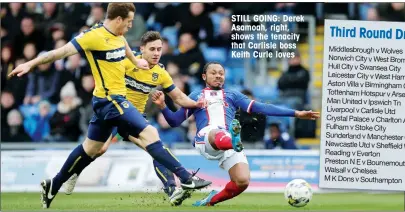  ??  ?? STILL GOING: Derek Asamoah, right, shows the tenacity that Carlisle boss Keith Curle loves