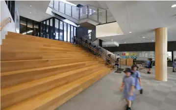  ??  ?? The Hellerup stair at South Melbourne Primary School by Hayball provides tiered seating as well as a space for meeting and presentati­ons.