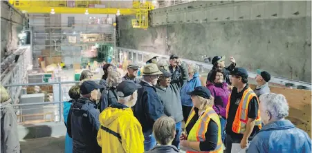  ??  ?? Members of the public tour the undergroun­d 10-storey high powerhouse cavern of the John Hart Generating Station replacemen­t project near Campbell River.