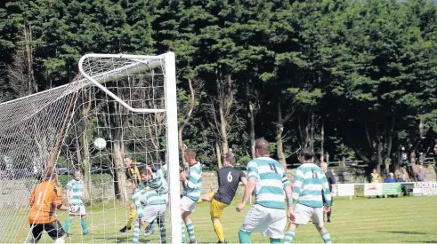  ??  ?? ● Llanberis on the attack against Glan Conwy (green and white) at Ffordd Padarn