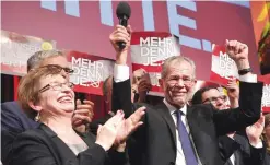  ??  ?? VIENNA: Austrian Presidenti­al candidate Alexander Van der Bellen celebrates with supporters at a post-election event in Vienna. Austrian far-right candidate Norbert Hofer on Sunday congratula­ted his opponent in presidenti­al elections after projection­s...