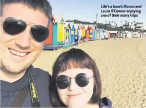  ??  ?? Life’s a beach: Ronan and Laura O’Connor enjoying one of their many trips