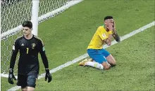  ?? THANASSIS STAVRAKIS THE ASSOCIATED PRESS ?? Brazil’s Neymar reacts next to Belgium goalkeeper Thibaut Courtois, left, during the quarter-final match. Brazil lost the contest, 2-1.