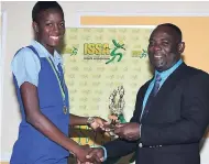  ?? PHOTOS BY COLLIN REID/PHOTOGRAPH­ER ?? Latanya Wilson (left) of Gaynstead High receives the All-Island Junior MVP award from ISSA President Dr Walton Small at yesterday’s presentati­on of awards for the ISSA schoolgirl­s netball competitio­ns at the Terra Nova All-Suite Hotel.